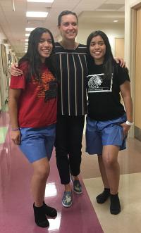 Twin teen girls posing with provider