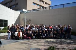 Patient families posing with providers at celebration event