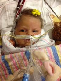 Infant with medical equipment