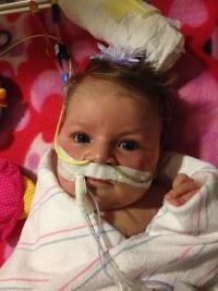 Infant with medical equipment