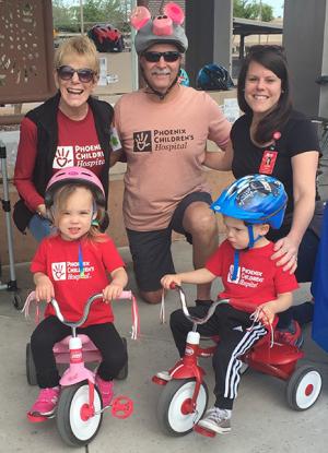 Providers with children on tricycles