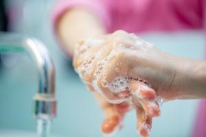 Close up of hands being washed