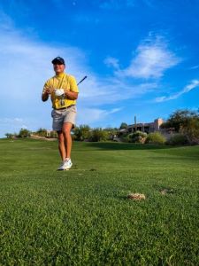 Teen playing golf