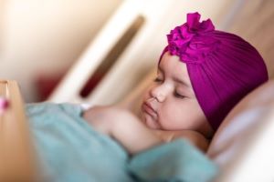 Toddler sleeping in hospital bed