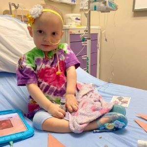 Toddler in hospital bed during treatment