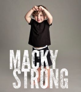 Toddler flexing his muscles