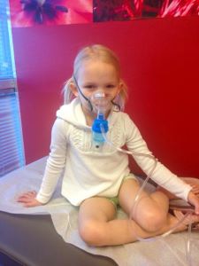 Girl getting a breathing treatment