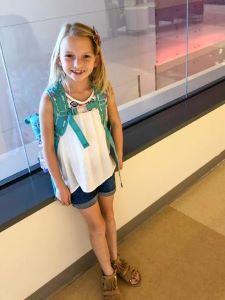 Girl with a blue backpack