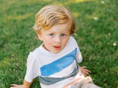 Boy sitting in grass