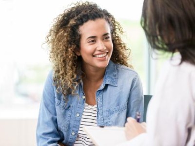 Young woman speaking to provider