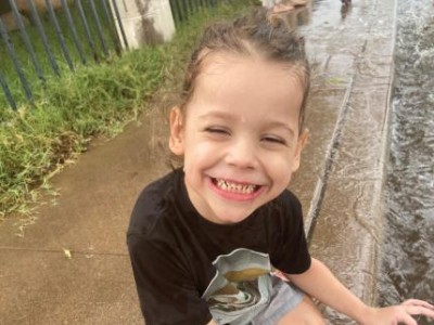 Toddler playing in the rain