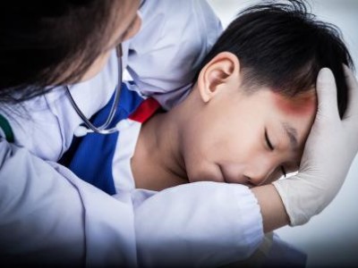 Provider holding child with head injury