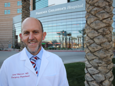 Doctor in front of hospital