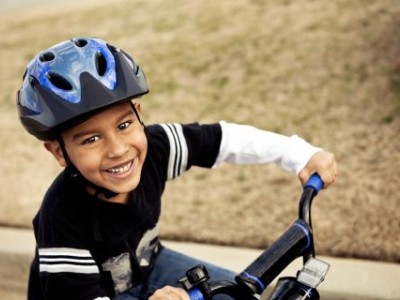 Boy wearing helmet on bicycle