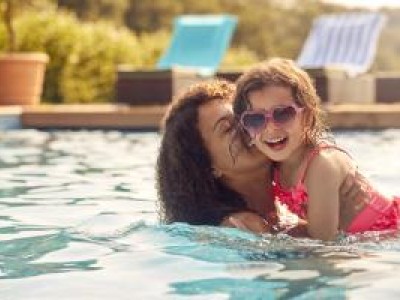 Mother and daughter in swimming pool