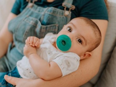 Baby with pacifier in mouth
