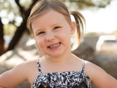 Young girl smiling at camera