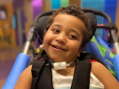 Smiling boy in stroller