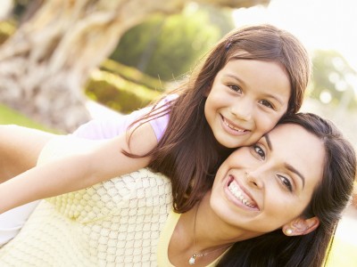Mother and daughter piggyback