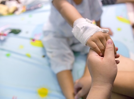 Child with wrapped wound in hospital