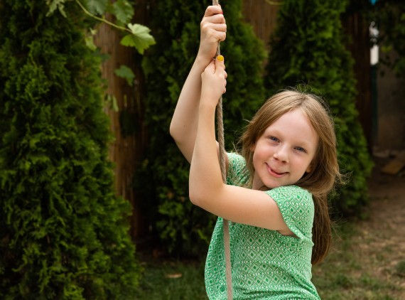 Girl on swing smiling