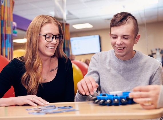 child playing games with his mom