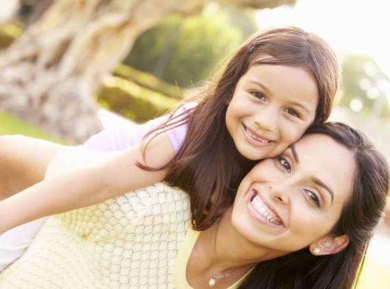 Mother and daughter piggyback