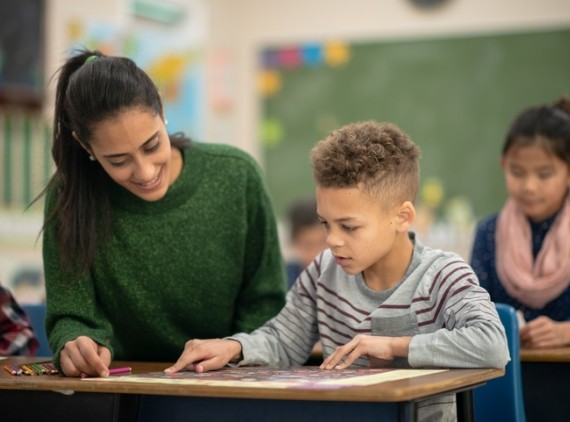 Student and teacher in classroom setting