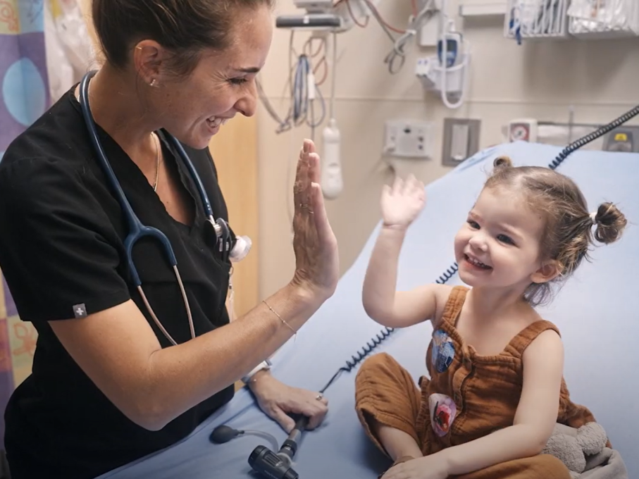 Doctor high fiving patient