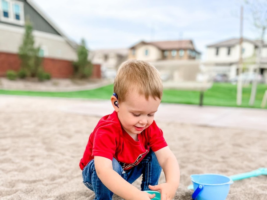Toddler playing in sand