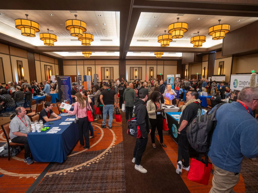 Attendees walking around tables at EMS conference