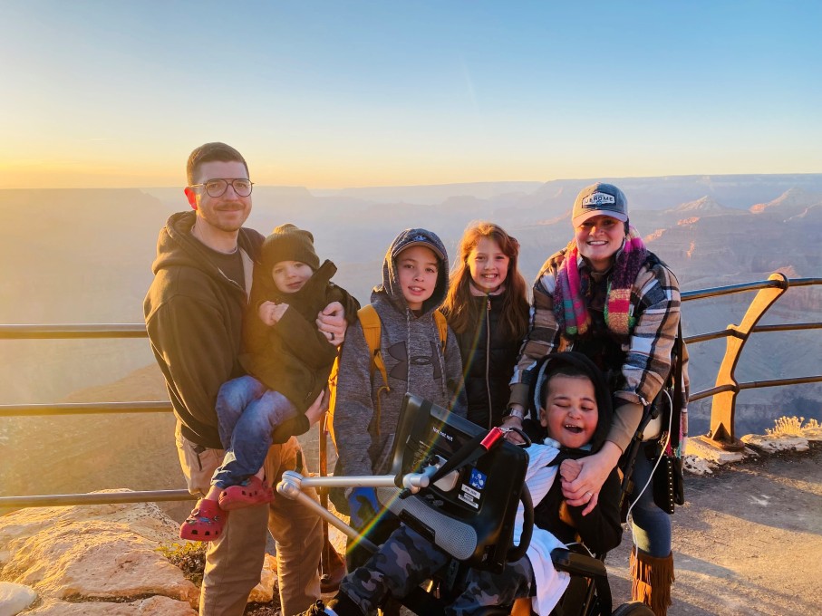 Family of 6 posing at Grand Canyon